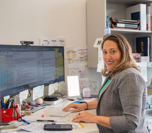 Dr. Analisa DiFeo works in her office.